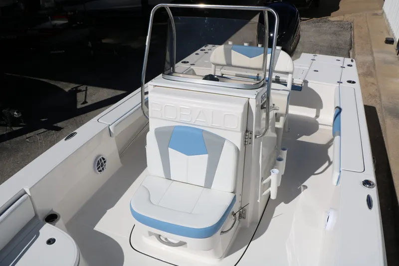 Slide: The Image of 2026 Robalo 226 Cayman boat with blue and white seating. - 24