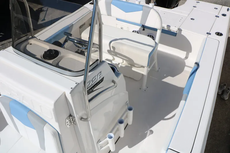 Slide: The Image of Interior of 2026 Robalo 226 Cayman boat, white and blue. - 26