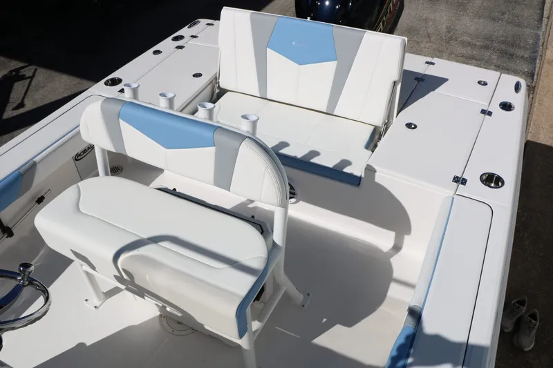 Slide: The Image of Interior of 2026 Robalo 226 Cayman with blue and white seating. - 28