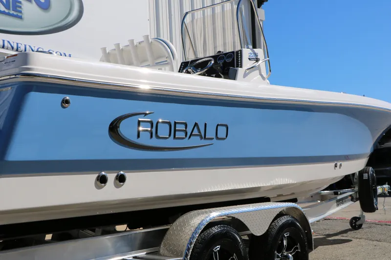 Slide: The Image of 2026 Robalo 226 Cayman boat on trailer, side view. - 8