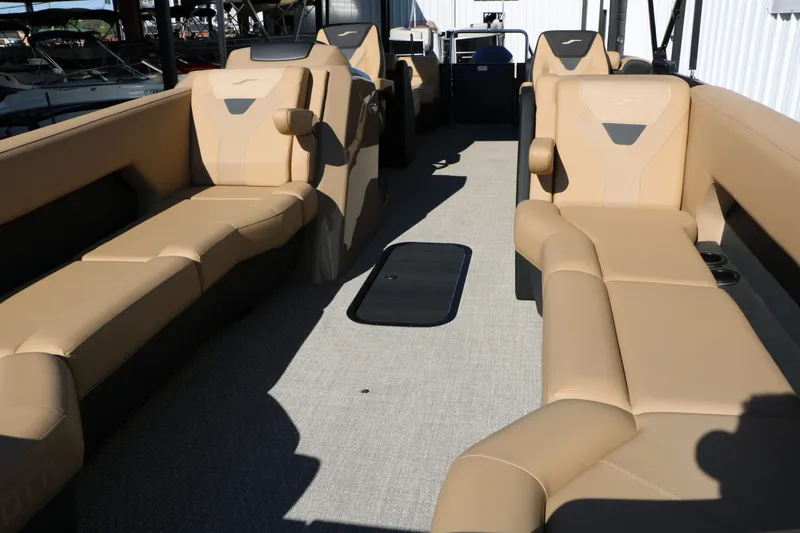 Slide: The Image of Interior of 2026 Evotti 525 QL Tri Toon with beige leather seating. - 16