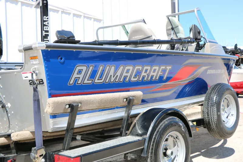 Slide: The Image of 2008 Alumacraft Dominator 165 Sport boat on trailer. - 8