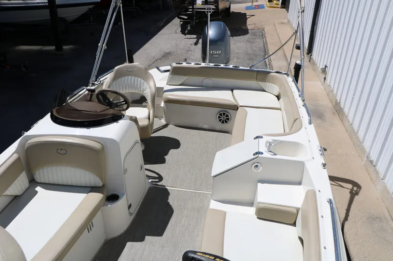 Slide: The Image of Interior of a 2015 Stingray 192 SC boat with beige seating. - 27