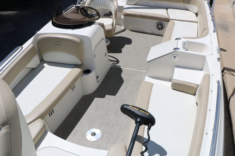 Slide: The Image of Interior of a 2015 Stingray 192 SC boat with beige seating. - 29