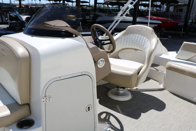 Slide: The Image of Interior of a 2015 Stingray 192 SC boat with steering console. - 30