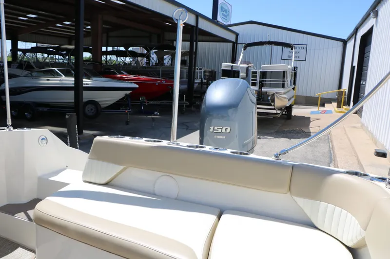 Slide: The Image of 2015 Stingray 192 SC boat with Yamaha 150 engine in storage facility. - 36