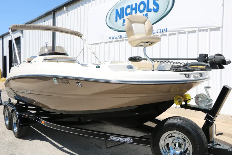 Slide: The Image of 2015 Stingray 192 SC boat on trailer at Nichols Marine. - 4