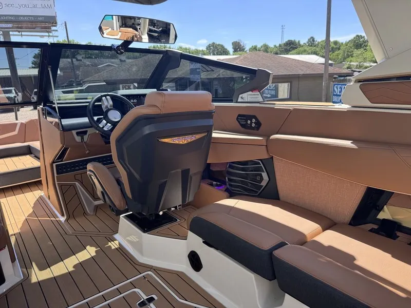 Slide: The Image of Interior of 2026 Nautique Super Air Nautique G25 with luxurious features. - 11