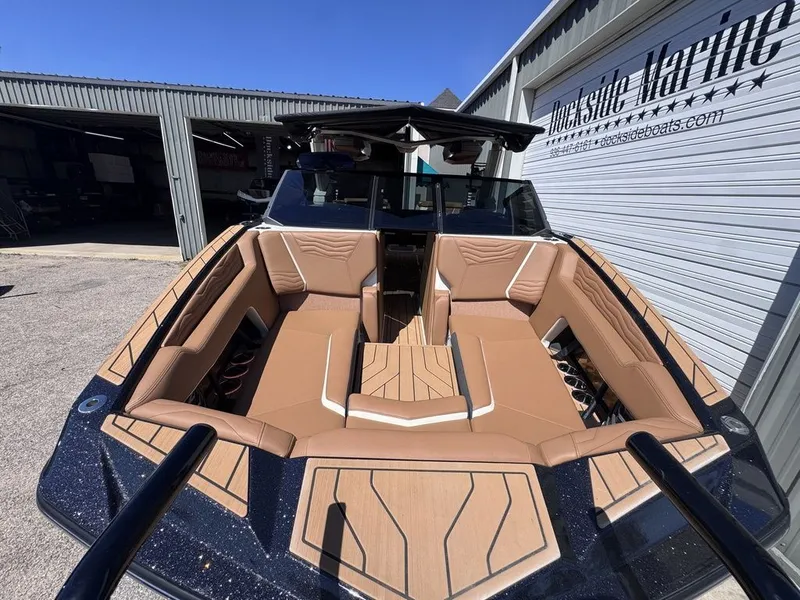 Slide: The Image of 2026 Nautique Super Air Nautique G25 with luxurious interior seating. - 16