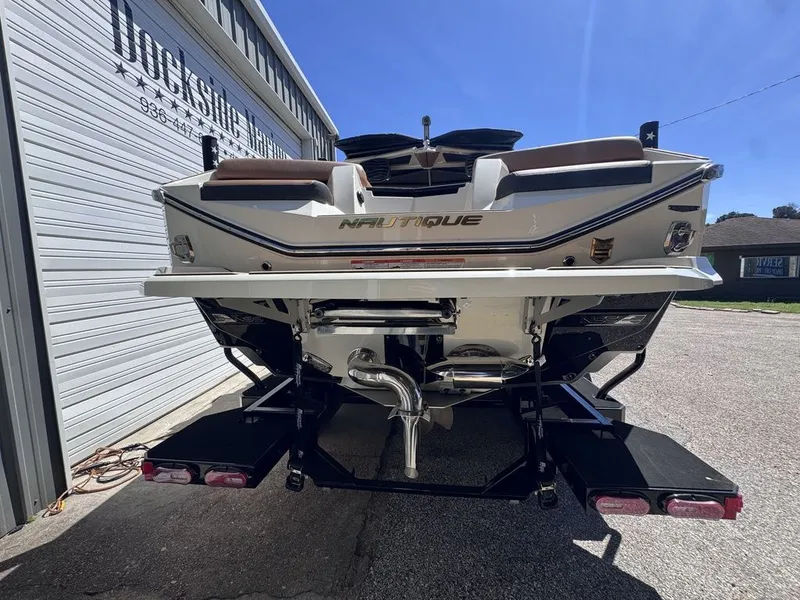Slide: The Image of Rear view of a 2026 Nautique Super Air Nautique G25 boat. - 18