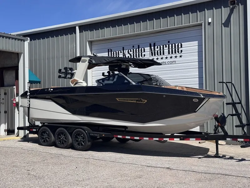 Slide: The Image of 2026 Nautique Super Air Nautique G25 boat on trailer at Dockside Marine. - 2