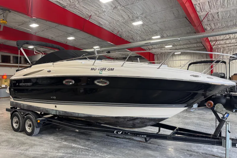 Slide: The Image of 2005 Monterey 250 Cruiser boat on trailer in indoor storage facility. - 16