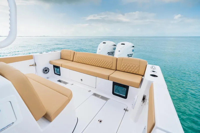 Slide: The Image of Manufacturer Provided Image: 2025 Sportsman Heritage 321 Center Console boat with tan seating on open water. - 8
