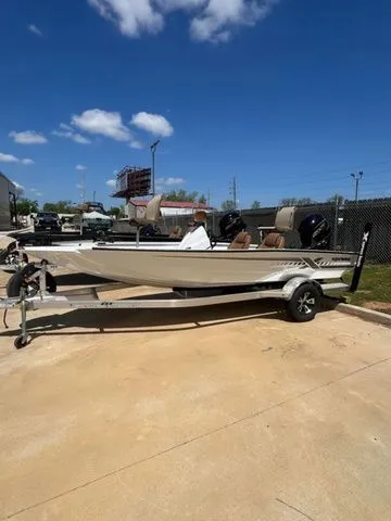 The Image of 2026 Xpress Boats H18C on trailer under blue sky. - 1
