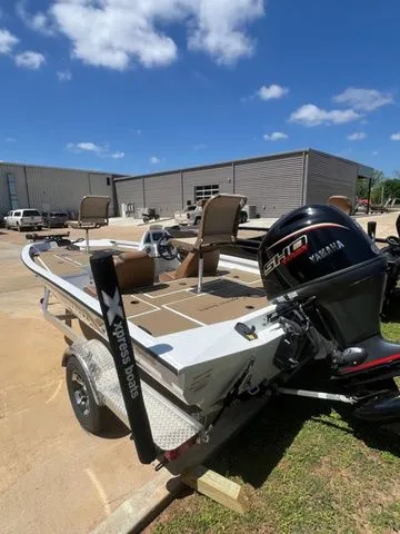 Slide: The Image of 2026 Xpress Boats H18C with Yamaha motor on trailer. - 4