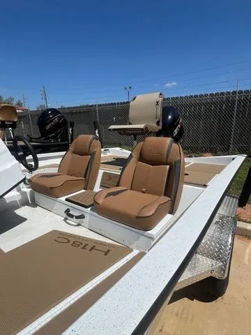 Slide: The Image of 2026 Xpress Boats H18C with brown seats and engines. - 5