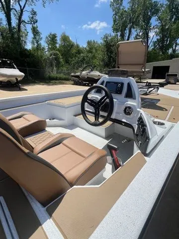 Slide: The Image of Interior of 2026 Xpress Boats H18C with modern helm console. - 6