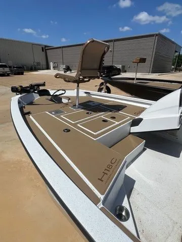 Slide: The Image of 2026 Xpress Boats H18C on a sunny parking lot. - 7