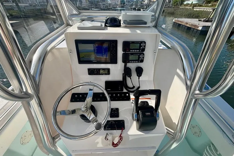 Slide: The Image of Helm of 2018 Contender 25 Tournament boat with navigation and control systems. - 18