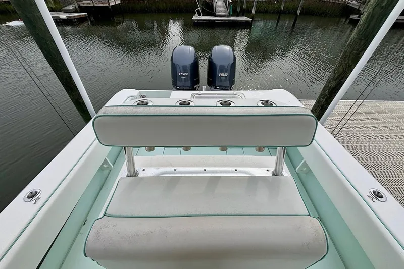 Slide: The Image of 2018 Contender 25 Tournament boat with dual 150 horsepower engines at dock. - 8