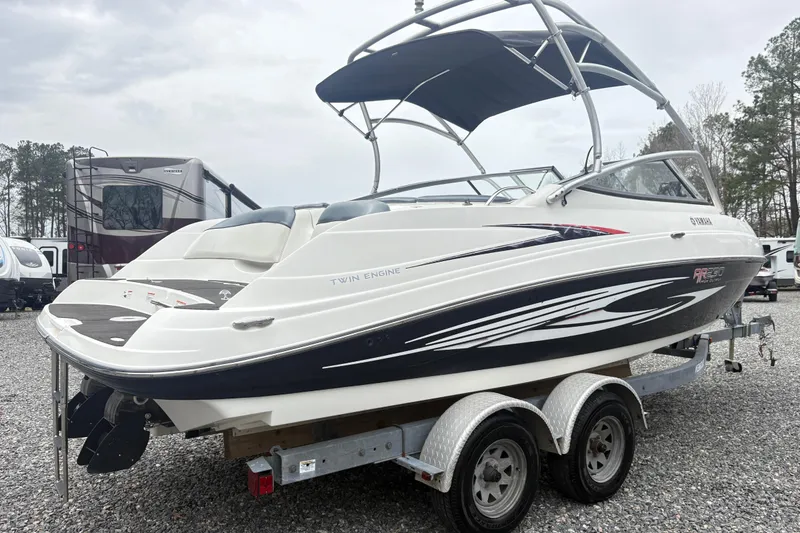 Slide: The Image of 2007 Yamaha AR230 boat on trailer, featuring twin engines and sleek design. - 3