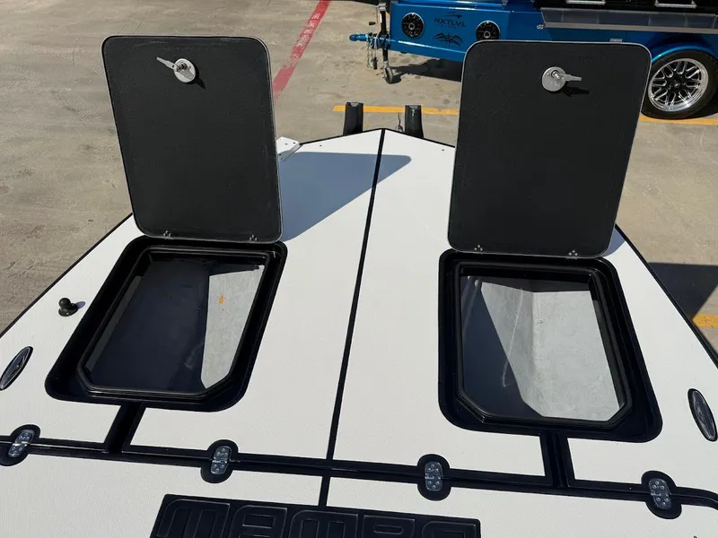 Slide: The Image of Mamba 24 Cat Elite 2025 with open storage compartments on deck. - 15