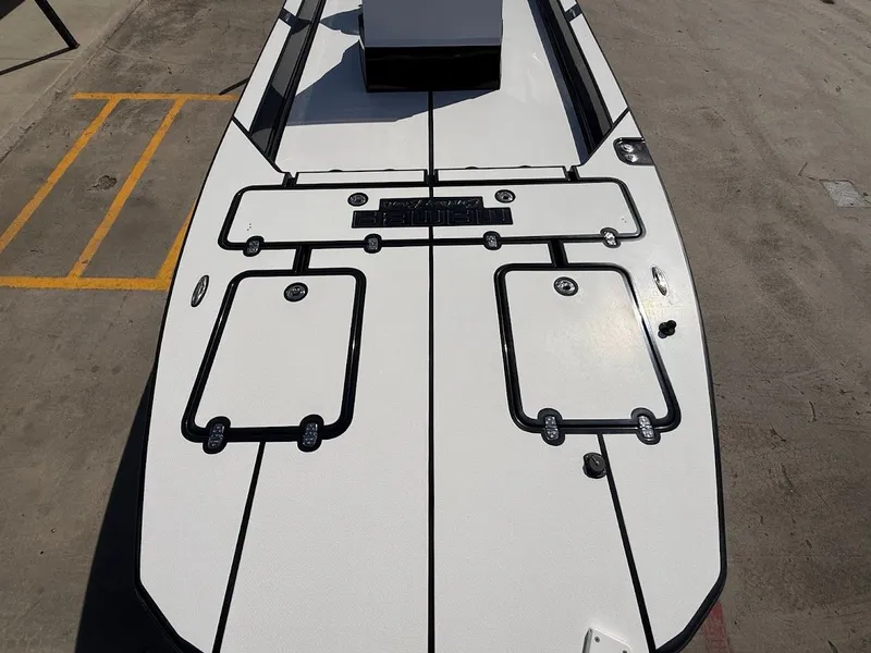 Slide: The Image of Close-up of 2025 Mamba 24 Cat Elite boat deck. - 17
