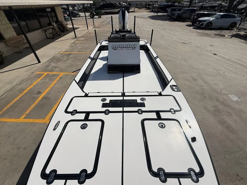 Slide: The Image of Mamba 24 Cat Elite 2025 on a parking lot. - 18