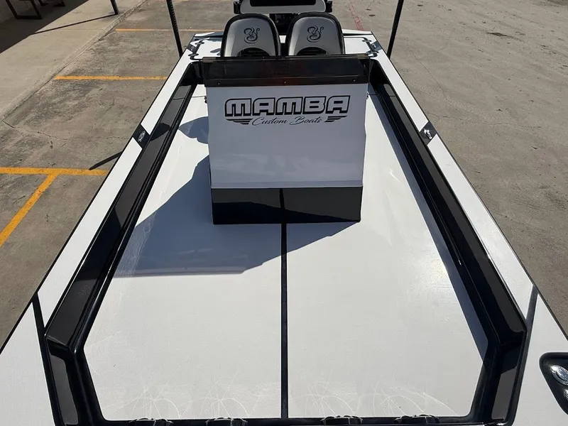 Slide: The Image of Mamba 24 Cat Elite 2025 boat on parking lot, front view. - 19