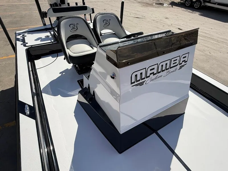 Slide: The Image of 2025 Mamba 24 Cat Elite boat with sleek design. - 21