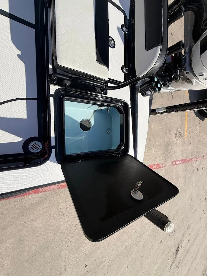 Slide: The Image of Mamba 24 Cat Elite 2025 with open storage compartment lid. - 33