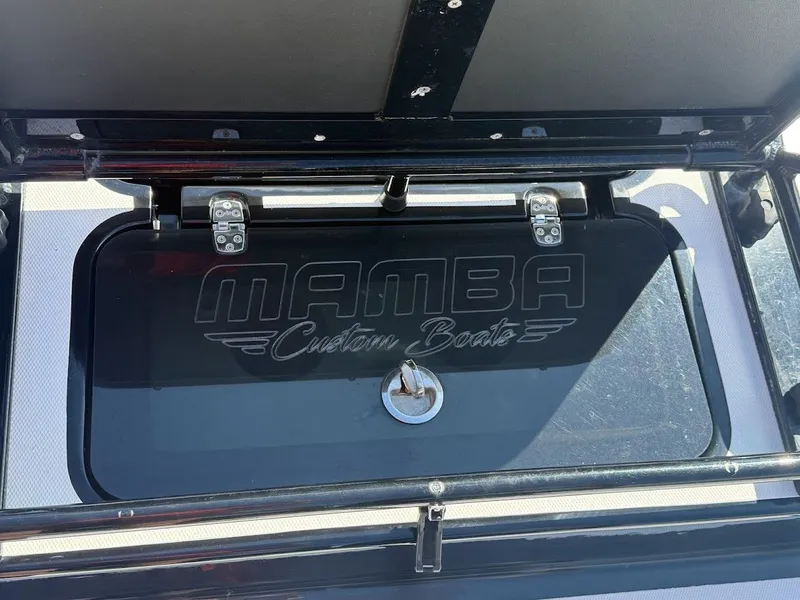 Slide: The Image of Mamba 24 Cat Elite 2025 boat hatch with logo. - 34