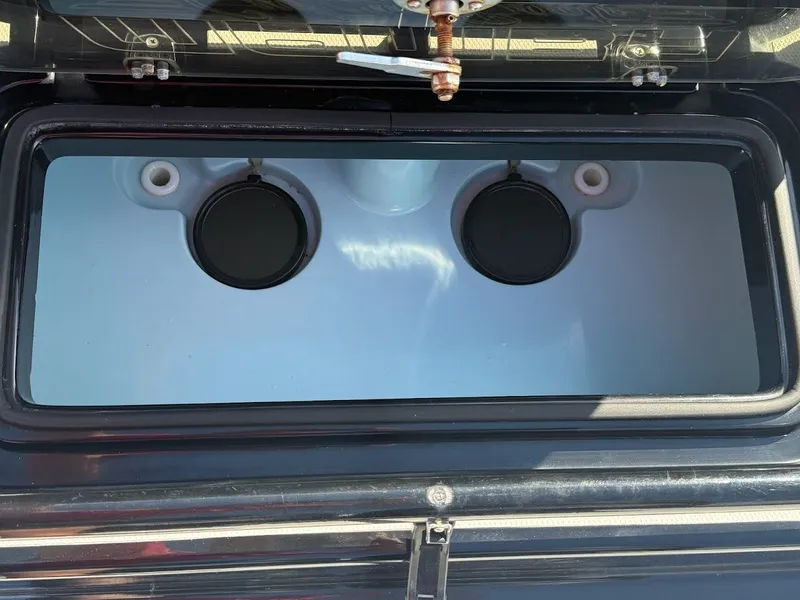 Slide: The Image of Mamba 24 Cat Elite 2025, interior storage compartment view. - 35