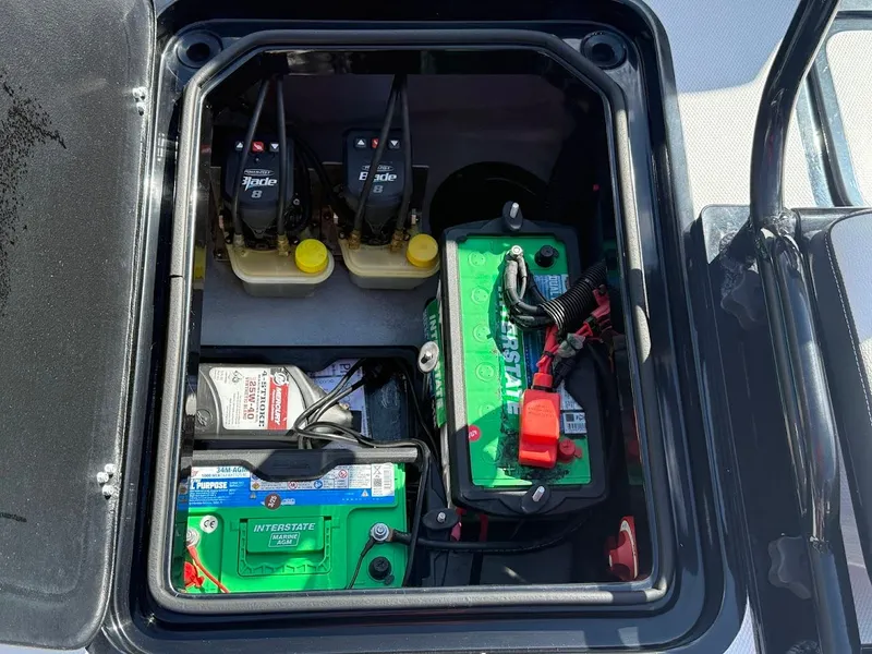 Slide: The Image of Battery compartment of Mamba 24 Cat Elite 2025 with Interstate batteries. - 36