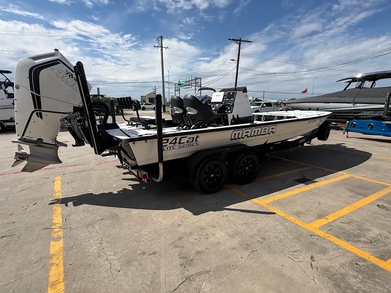 Slide: The Image of 2025 Mamba 24 Cat Elite boat on trailer outdoors. - 7