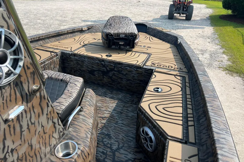 Slide: The Image of 2025 Xpress H20B Bay boat interior with custom SeaDek flooring and speaker system. - 13