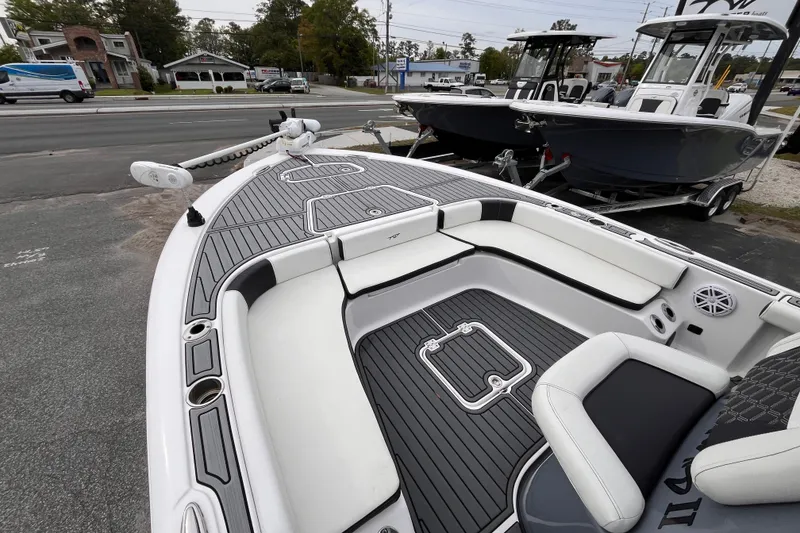 Slide: The Image of 2021 Tidewater 2300 Carolina Bay boat on a parking lot. - 12