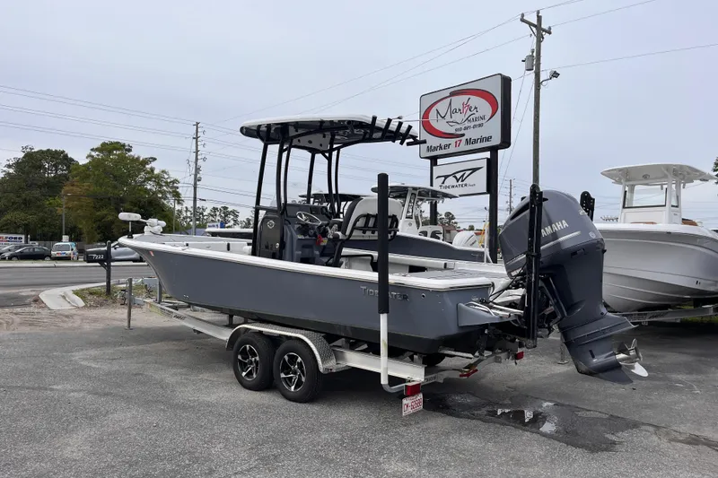 Slide: The Image of 2021 Tidewater 2300 Carolina Bay boat on trailer at Marker 17 Marine dealership. - 2