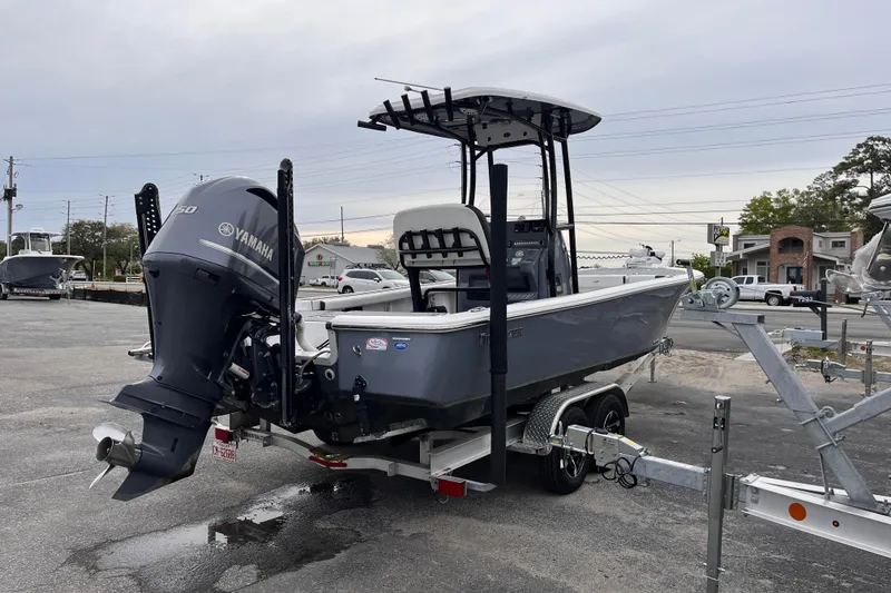 Slide: The Image of 2021 Tidewater 2300 Carolina Bay boat with Yamaha engine on trailer in parking lot. - 4