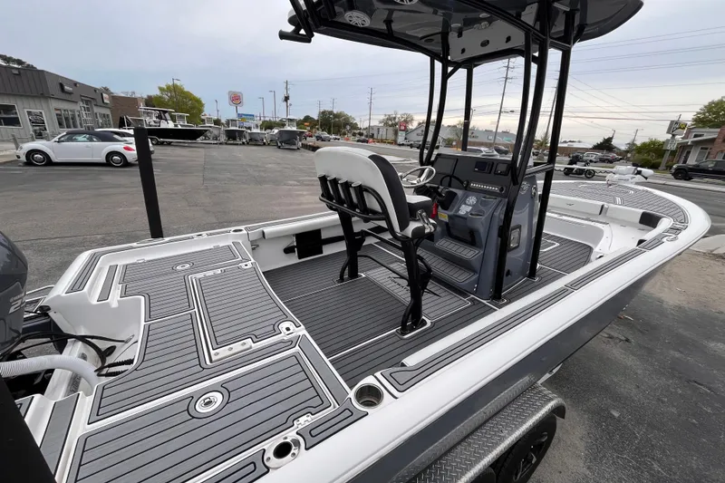 Slide: The Image of 2021 Tidewater 2300 Carolina Bay boat with sleek deck design and modern console. - 5