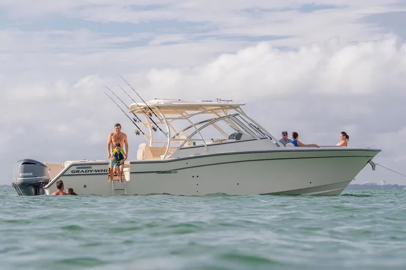 The Image of Manufacturer Provided Image: 2023 Grady-White Freedom 335 boat with people enjoying water activities. - 0