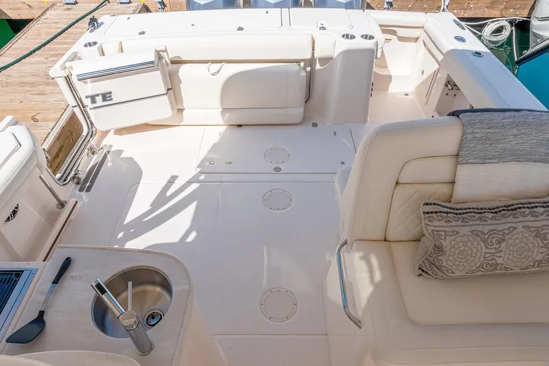 Slide: The Image of Manufacturer Provided Image: 2023 Grady-White Freedom 335 boat interior with seating and sink. - 10