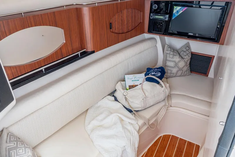 Slide: The Image of Manufacturer Provided Image: Interior cabin of 2023 Grady-White Freedom 335 boat with seating and entertainment system. - 14