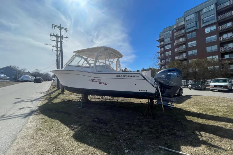 Slide: The Image of 2023 Grady-White Freedom 335 boat on display near urban buildings. - 17