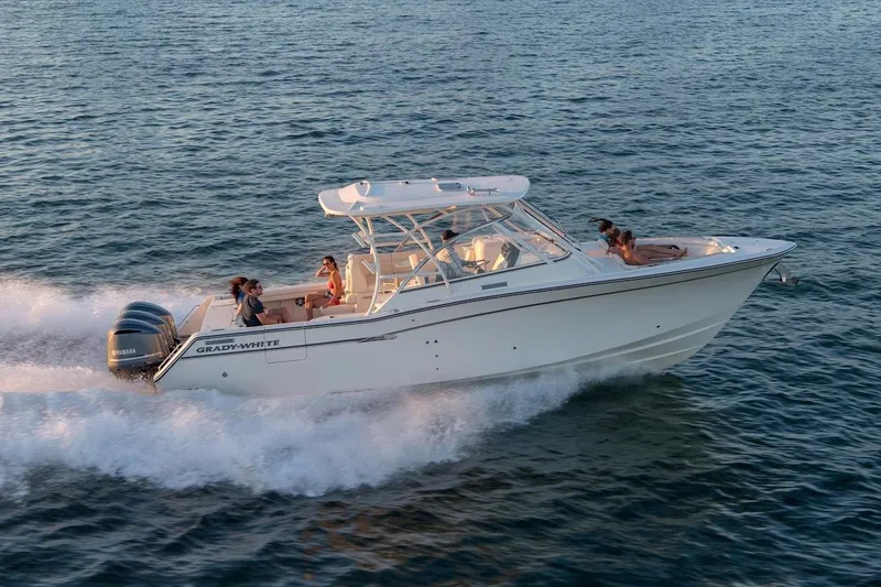 Slide: The Image of Manufacturer Provided Image: 2023 Grady-White Freedom 335 boat cruising on open water. - 2