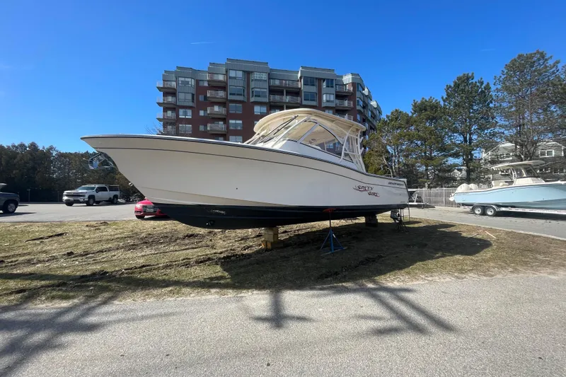 Slide: The Image of 2023 Grady-White Freedom 335 boat on display outdoors near buildings. - 21