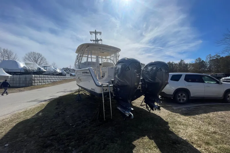 Slide: The Image of 2023 Grady-White Freedom 335 boat with dual Yamaha engines on display outdoors. - 22