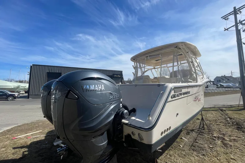 Slide: The Image of 2023 Grady-White Freedom 335 boat with Yamaha XTO engine, parked outdoors. - 23