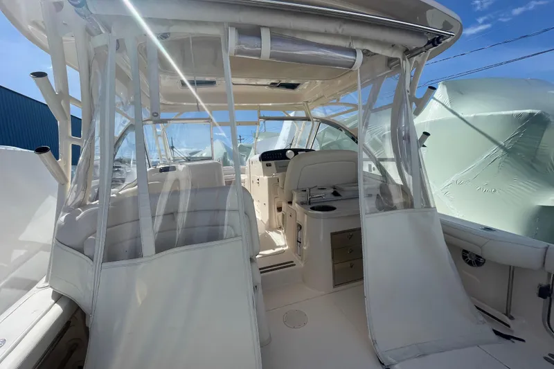 Slide: The Image of 2023 Grady-White Freedom 335 boat interior with seating and helm station. - 26