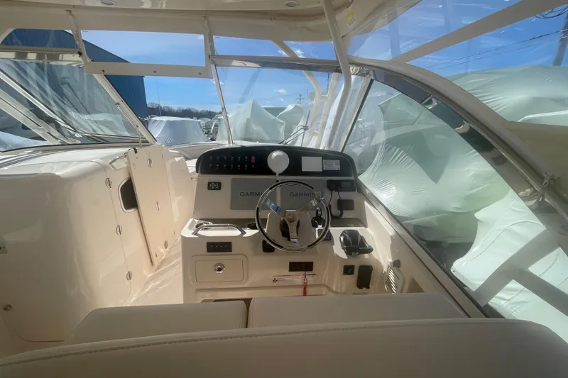 Slide: The Image of 2023 Grady-White Freedom 335 boat cockpit with Garmin navigation system. - 28